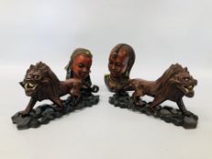 A COLLECTION OF ETHNIC CARVINGS AND ORNAMENTS TO INCLUDE A PAIR OF HAND CARVED LIONS,