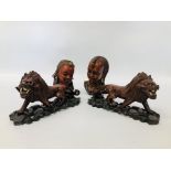 A COLLECTION OF ETHNIC CARVINGS AND ORNAMENTS TO INCLUDE A PAIR OF HAND CARVED LIONS,