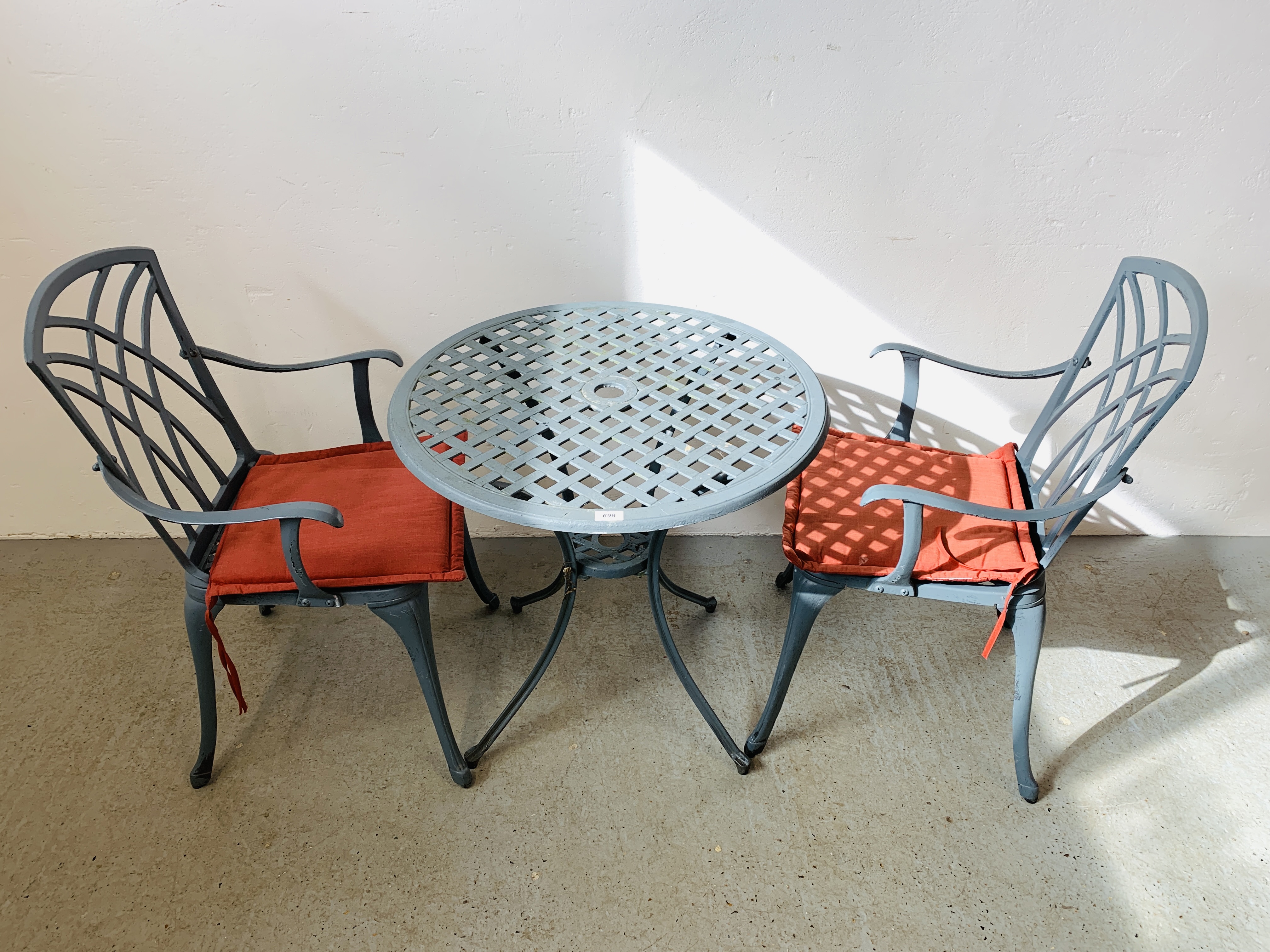 A CAST ALUMINIUM PATIO BISTRO SET COMPRISING CIRCULAR TABLE AND TWO CHAIRS WITH SEAT CUSHIONS - Image 2 of 6