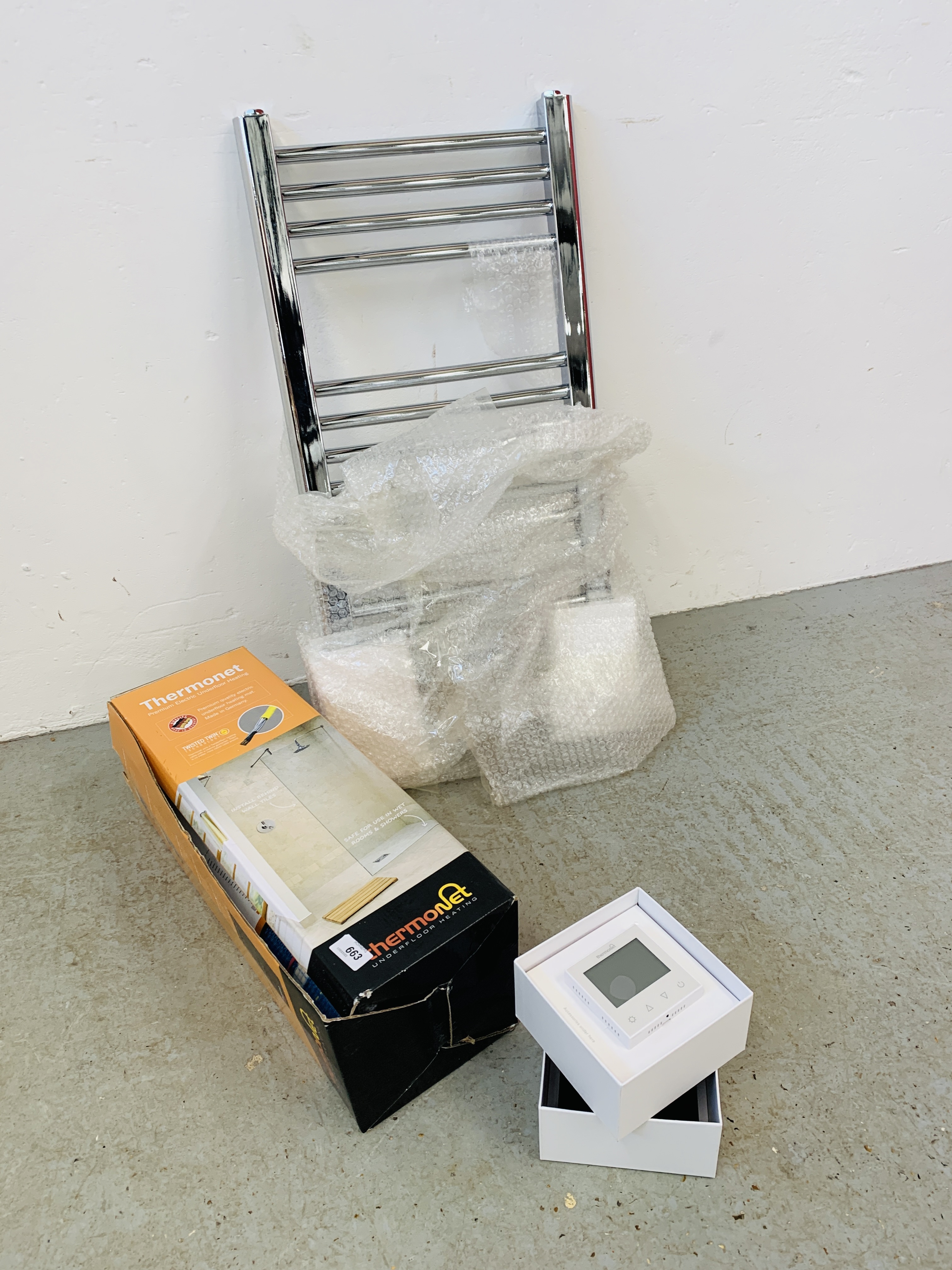 A BOXED THERMONET UNDER FLOOR HEATING SYSTEM WITH THERMOSTAT AND CHROME BATHROOM TOWEL RAIL - SOLD