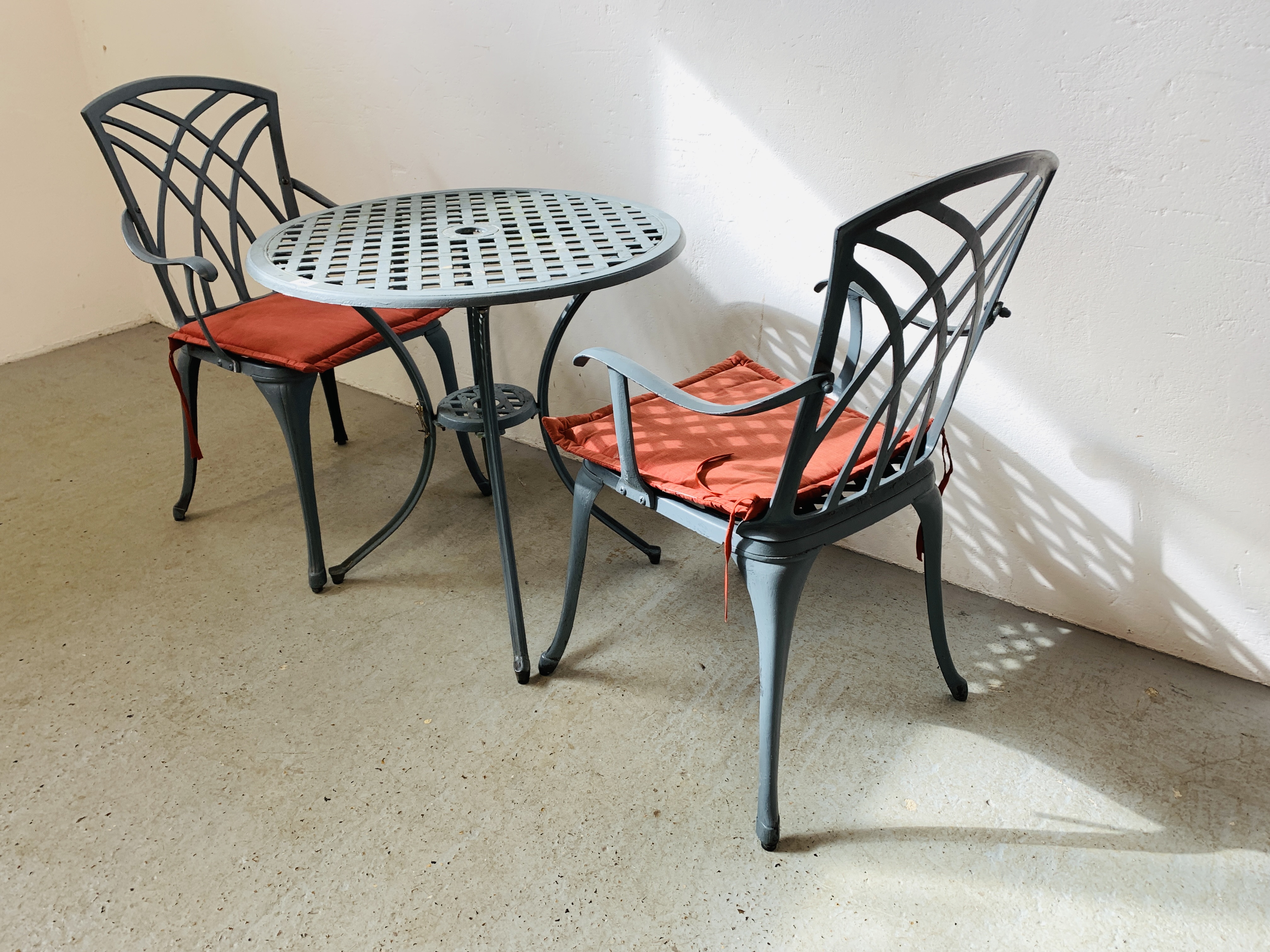 A CAST ALUMINIUM PATIO BISTRO SET COMPRISING CIRCULAR TABLE AND TWO CHAIRS WITH SEAT CUSHIONS - Image 3 of 6