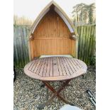 A TWO SEAT GARDEN LOVE ARBOUR AND FOLDING HARDWOOD GARDEN TABLE