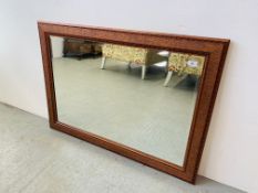 A LARGE BEVEL PLATE MIRROR IN DECORATIVE ROSE FRAME