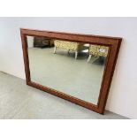 A LARGE BEVEL PLATE MIRROR IN DECORATIVE ROSE FRAME