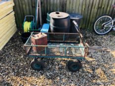 A METAL CAGE FRAMED FOUR WHEEL GARDEN BARROW, GARDEN HOSE, GALVANISED WATERING CAN, 2 WATER BUTTS,
