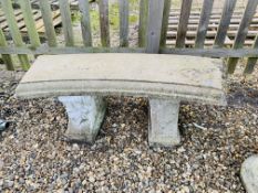 A HEAVY CONCRETE GARDEN BENCH WITH DETAILED SUPPORTS