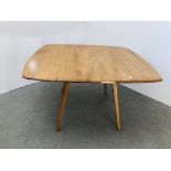 A BLONDE ERCOL DROP DINING TABLE