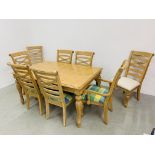 A REPRODUCTION BEECHWOOD FINISH EXTENDING DINING TABLE AND EIGHT DINING CHAIRS (SIX WITH MATCHING
