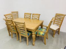 A REPRODUCTION BEECHWOOD FINISH EXTENDING DINING TABLE AND EIGHT DINING CHAIRS (SIX WITH MATCHING