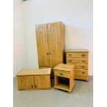 A MODERN FOUR PIECE PINE FINISH BEDROOM SUITE COMPRISING OF DOUBLE DOOR WARDROBE WITH DRAWER,