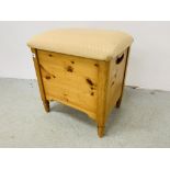 A SOLID PINE DRESSING STOOL WITH HINGED TOP W 44CM, D 33CM, H 47CM.