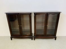 A PAIR OF STAG TWO DOOR GLAZED DISPLAY CABINETS WITH GLAZED SHELVES WIDTH 80CM. HEIGHT 100CM.