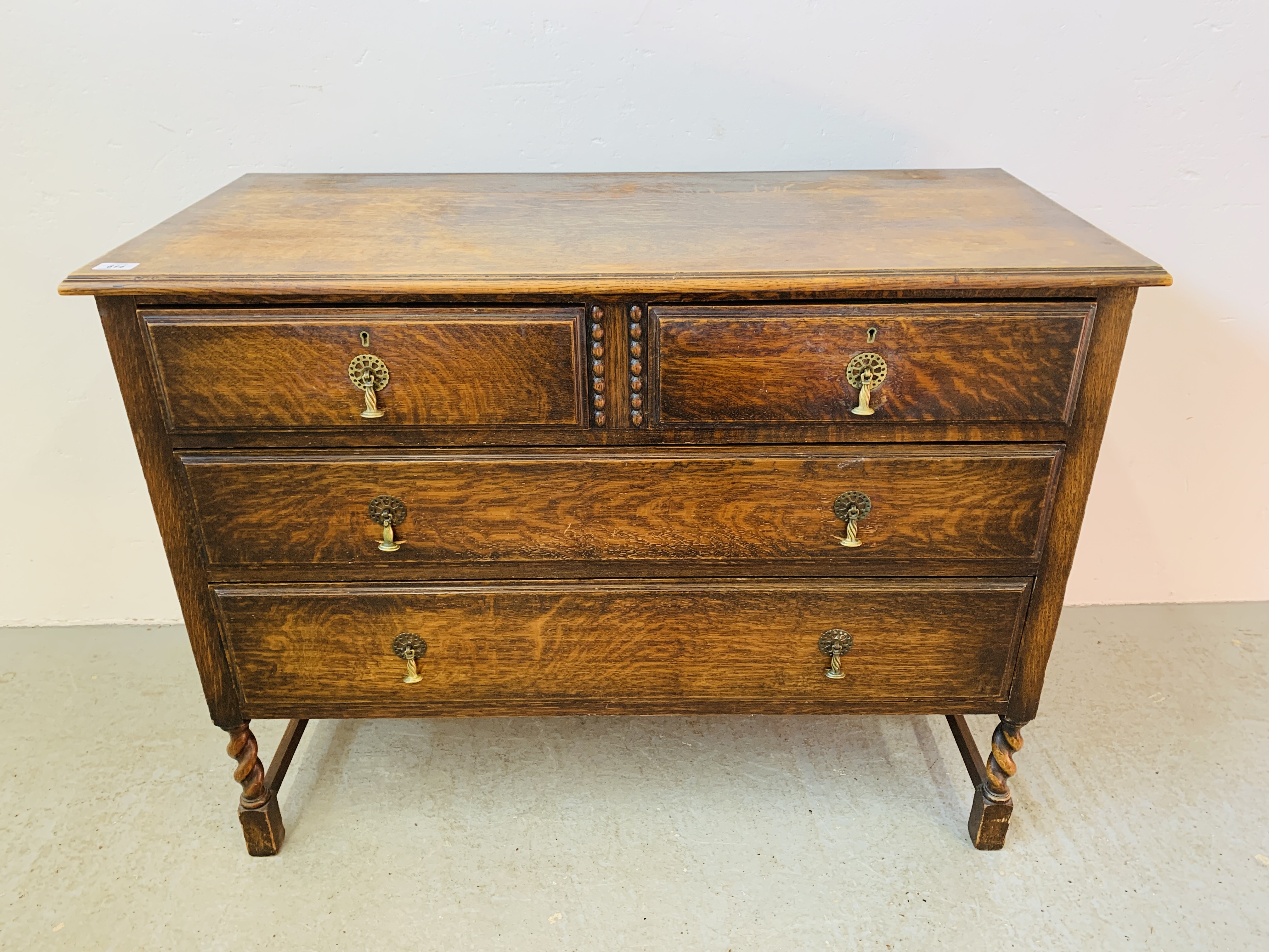 AN OAK 2 OVER 4 DRAWER CHEST ON BARLEY TWIST LEG SUPPORT 107CM. X 49CM. X 81CM.