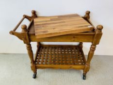 A PINE SINGLE DRAWER TROLLEY WITH SHELF BELOW AND HEAVY BLOCK CHOPPING BOARD