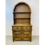 A SMALL TRADITIONAL ARCH TOP COTTAGE DRESSER THE BASE WITH TWO DRAWERS AND TWO CUPBOARD DOORS WIDTH