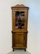 AN ANTIQUE OAK HALF GLAZED FLOOR STANDING CORNER CUPBOARD WIDTH 77CM. HEIGHT 209CM.