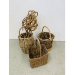 A GROUP OF THREE VINTAGE WICKER BASKETS AND TWO CARPET BEATERS.