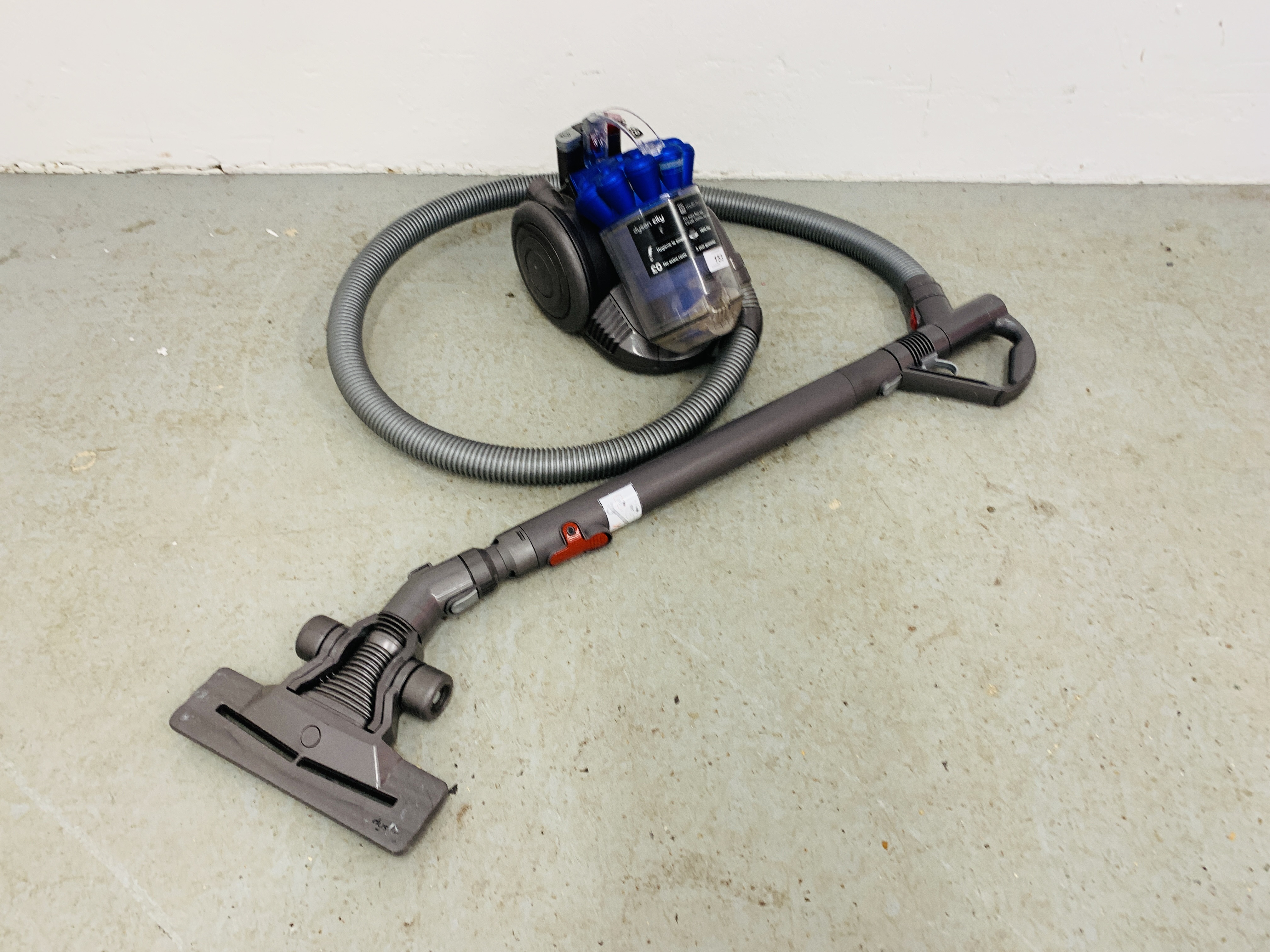 A DYSON DC26 COMPACT VACUUM CLEANER - SOLD AS SEEN.