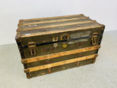 A VINTAGE METAL BOUND TRUNK 88CM X 49CM X 53CM.