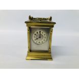 ANTIQUE BRASS CARRIDGE CLOCK WITH ENAMELLED FACE (REQUIRES ATTENTION TO THE REAR GLASS) H 14CM.