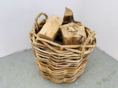 A WOVEN BAMBOO LOG BASKET AND LOGS ALONG WITH A QUANTITY OF FIRE LIGHTERS