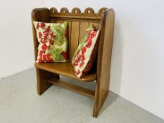 A SMALL PITCH PINE PEW + TWO CUSHIONS W 77CM.