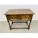 AN OAK TWO DRAWER SIDE TABLE WITH BOBBIN DETAIL W 92CM, D 51CM, H 82CM.