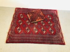 A VINTAGE AZTEC DESIGN RUG ON MAINLY RED BACKGROUND 106CM X 124CM ALONG WITH A CARPET PILLOW.