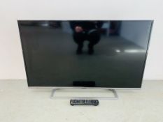 A PANASONIC 42 INCH FLAT SCREEN TV COMPLETE WITH REMOTE CONTROL - SOLD AS SEEN.