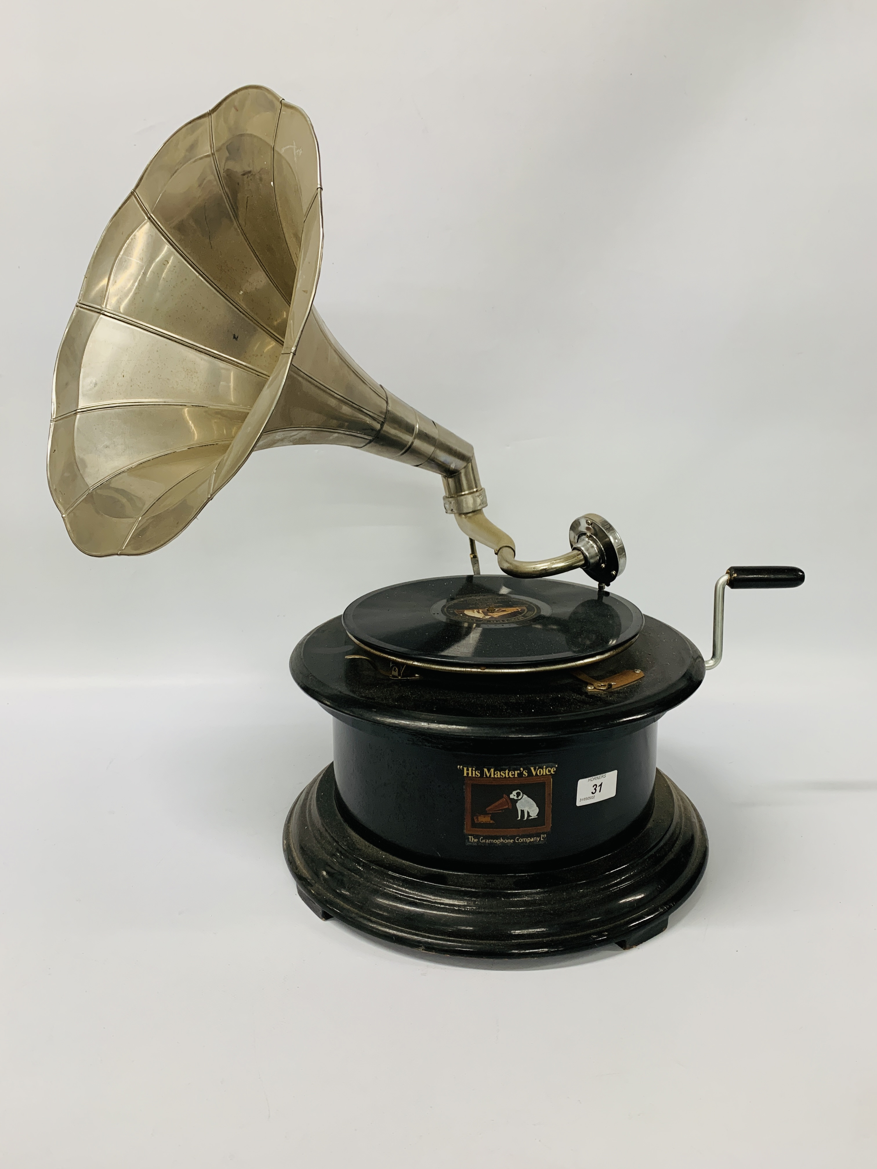 A TABLE TOP WIND UP HORN GRAMOPHONE MARKED "HIS MASTERS VOICE"