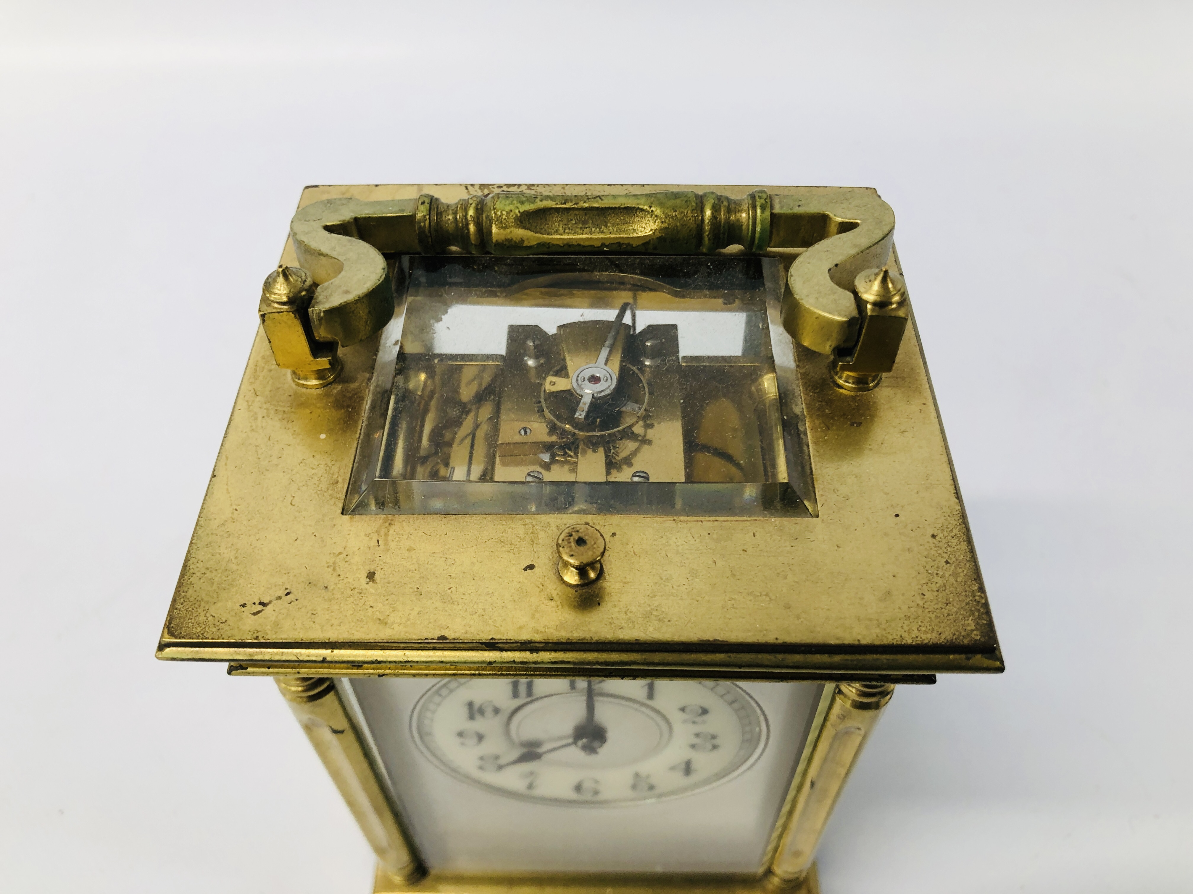 ANTIQUE BRASS CARRIDGE CLOCK WITH ENAMELLED FACE (REQUIRES ATTENTION TO THE REAR GLASS) H 14CM. - Image 2 of 9