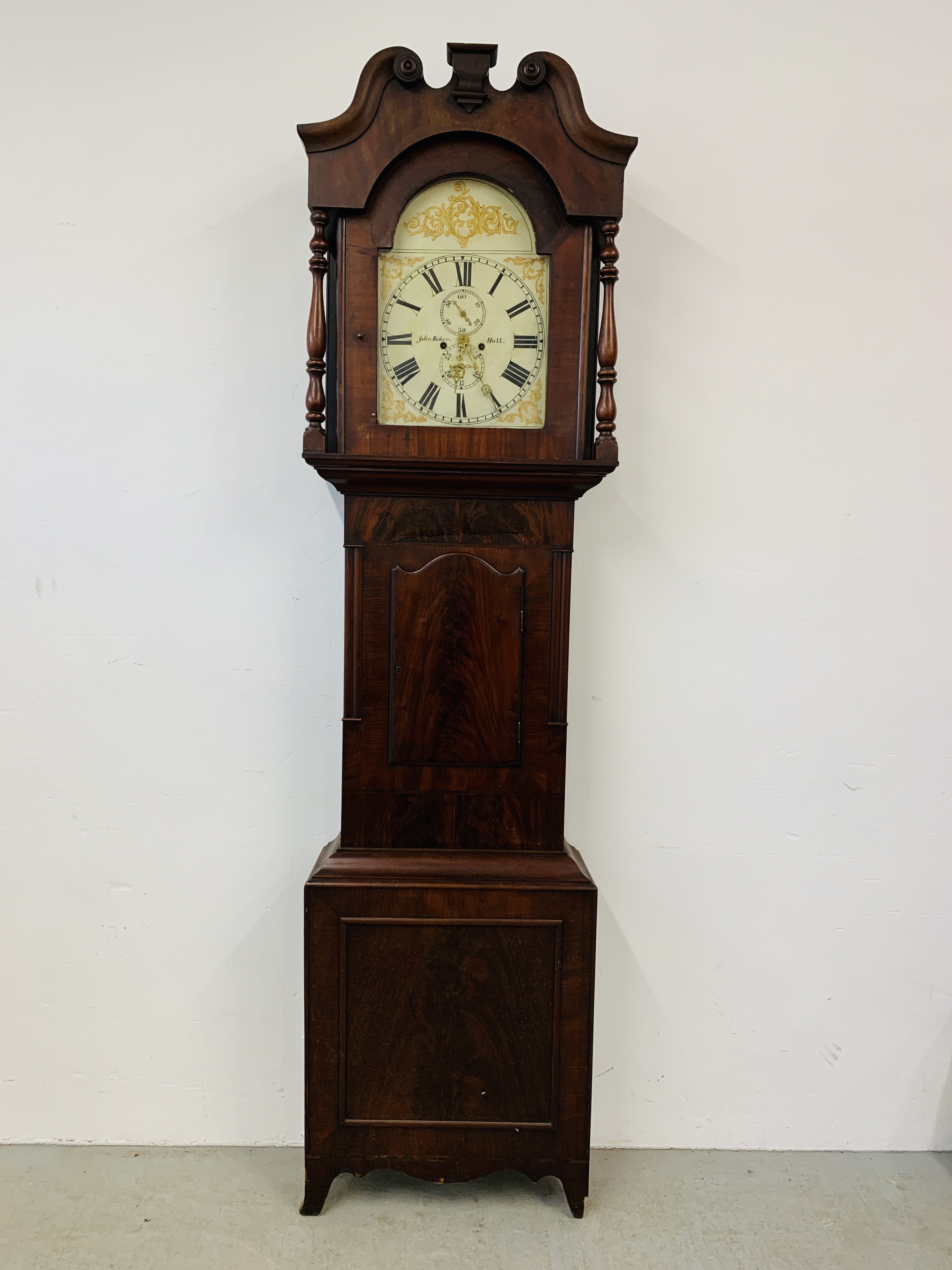 AN ANTIQUE MAHOGANY LONG CASE CLOCK THE HAND PAINTED ARCHED DIAL WITH ROMAN NUMERALS,