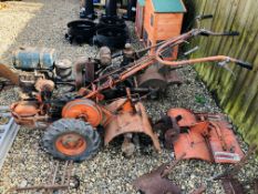 A HOWARD 350 PETROL GARDEN ROTOVATOR WITH 24 INCH REAR GUARD SHAFT AND BLADES ACCOMPANIED WITH