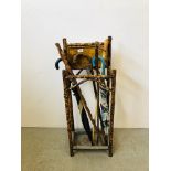 A BAMBOO STICK STAND COMPLETE WITH SIX VARIOUS WALKING STICKS INSET WITH ART NOUVEAU TILES.