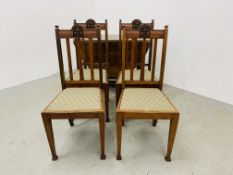 A SET OF FOUR OAK FRAMED DINING CHAIRS WITH UPHOLSTERED SEATS + A HEAVY OAK GATELEG DINING TABLE