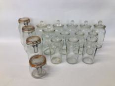 COLLECTION OF 16 CLEAR GLASS STORAGE JARS.