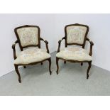 A PAIR OF REPRODUCTION OPEN ARM CHAIRS (TRADE SALE ONLY).