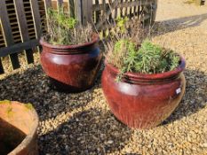 A PAIR OF LARGE BROWN GLAZED GARDEN PLANTERS DIAMETER 52CM. HEIGHT 44CM.
