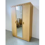 A MODERN LIGHT OAK DOUBLE WARDROBE WITH CENTRAL MIRRORED PANEL W 114CM, D 52CM, H 185CM.