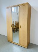 A MODERN LIGHT OAK DOUBLE WARDROBE WITH CENTRAL MIRRORED PANEL W 114CM, D 52CM, H 185CM.