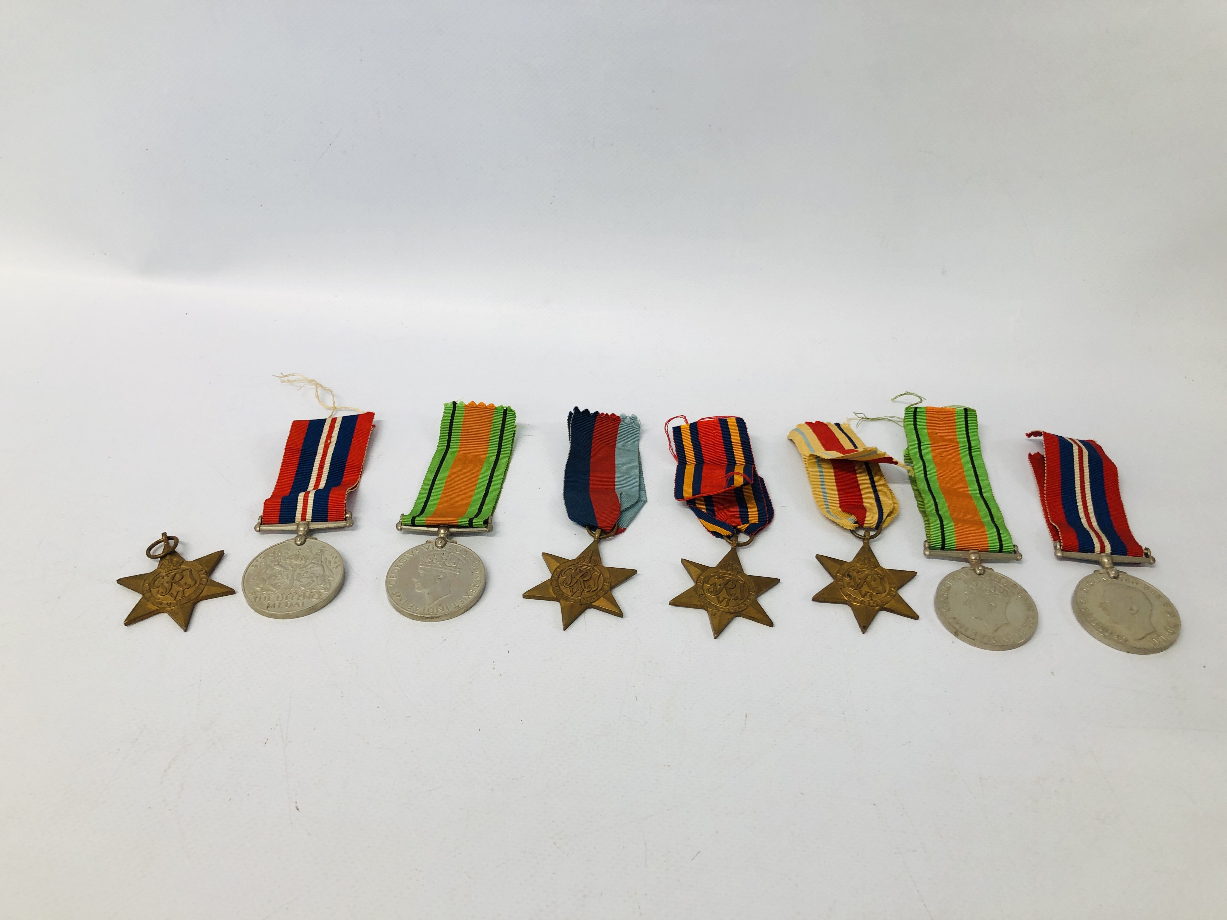 TWO WWII MEDALS, TWO WWII DEFENCE MEDALS, TWO 39-45 STARS, AN AFRICA STAR AND A BURMA STAR,