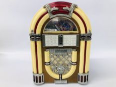 A RADIO/TAPE PLAYER MINIATURE JUKE BOX