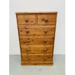 A HONEY PINE TWO OVER FOUR CHEST OF DRAWERS WITH TURNED WOODEN KNOBS WIDTH 75CM. DEPTH 40CM.