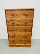 A HONEY PINE TWO OVER FOUR CHEST OF DRAWERS WITH TURNED WOODEN KNOBS WIDTH 75CM. DEPTH 40CM.