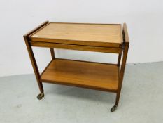 A TEAK METAMORPHIC TROLLEY TABLE