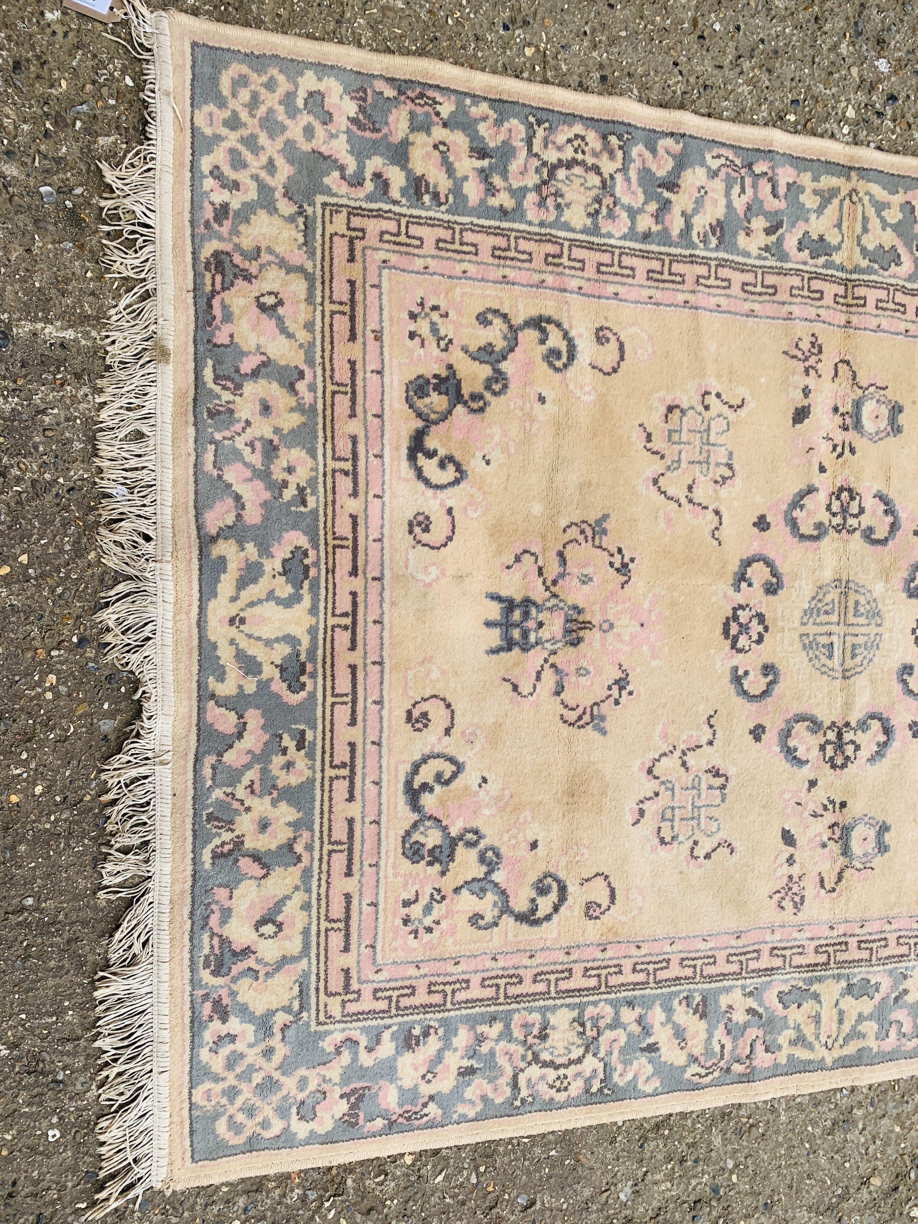 A CHINESE RUG BLUE / PINK PATTERNED ON BEIGE GROUND 1.7M X 1.25M. - Image 2 of 6