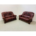 A PAIR OF OXBLOOD LEATHER TWO SEATER SOFAS