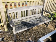 A WEATHERED HARDWOOD GARDEN BENCH - LENGTH 163CM.