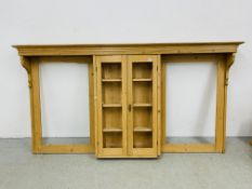 A WAXED PINE DRESSER BACK WITH CENTRAL TWO DOOR CUPBOARD A/F