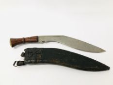 AN INDIAN KUKRI KNIFE IN A LEATHER SHEATH - COLLECTION ONLY.